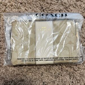 Coach Light Tan Wristlet with Gold Logo